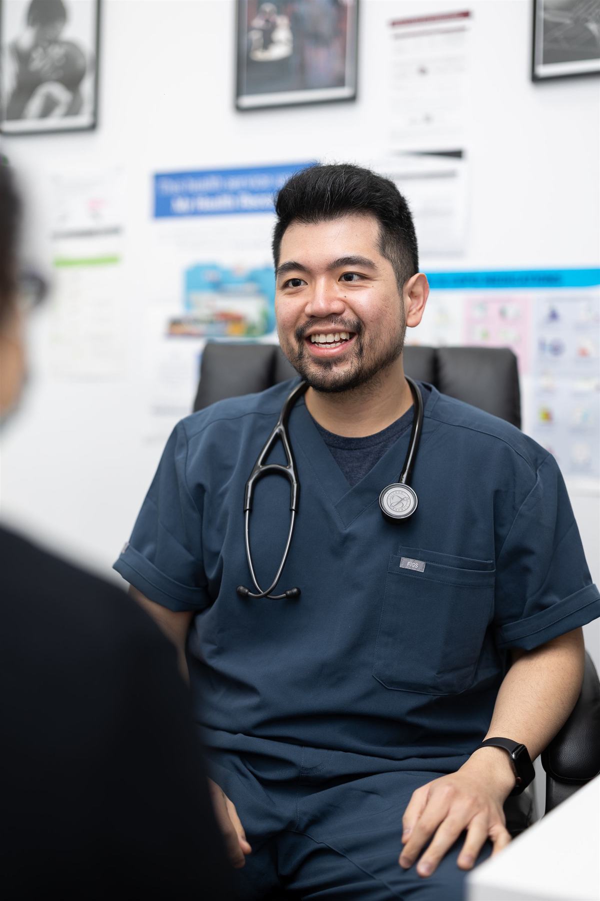 One of our GPs smiling during a consultation