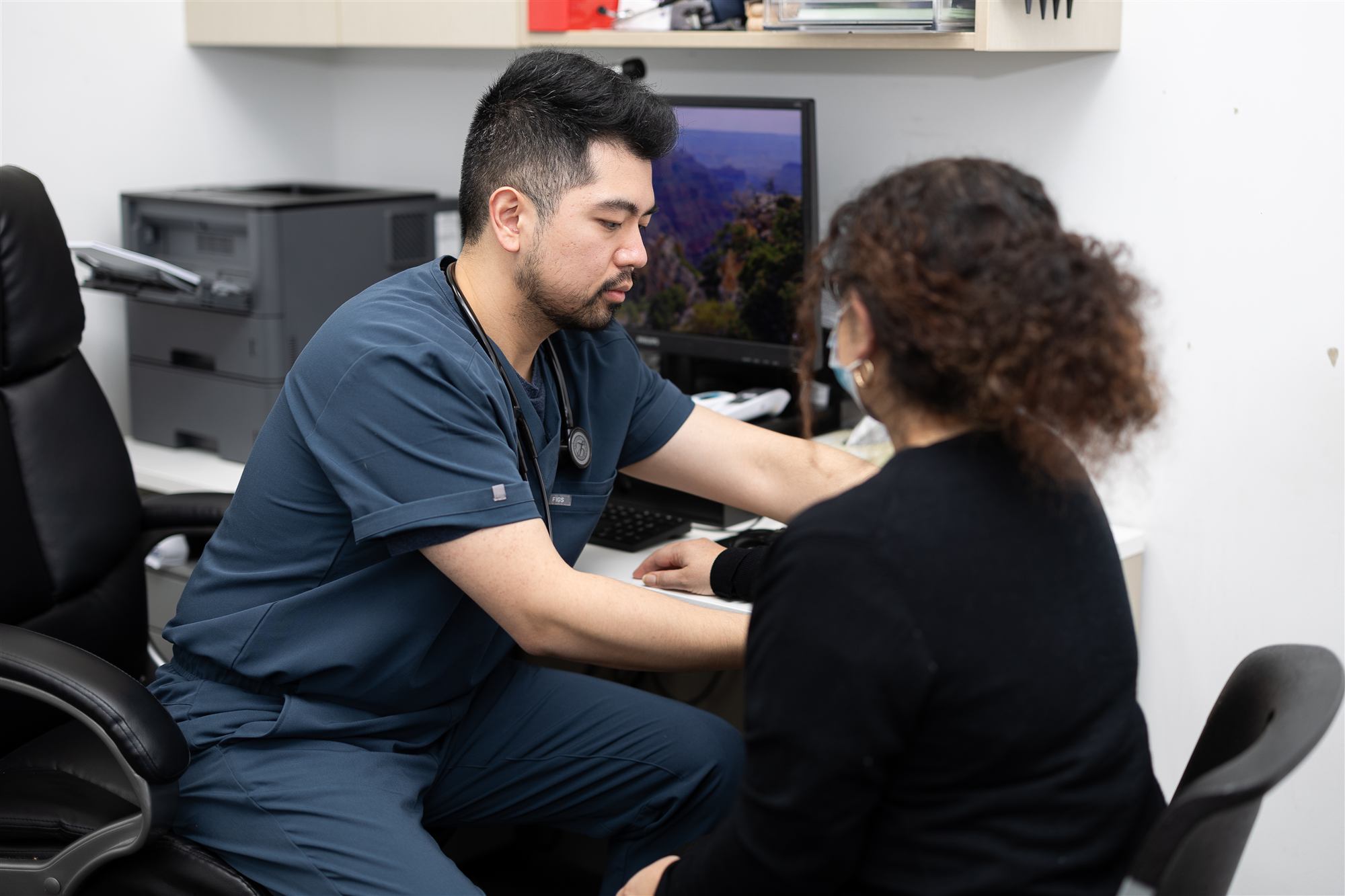 One of our GPs talking with a patient during a consultation